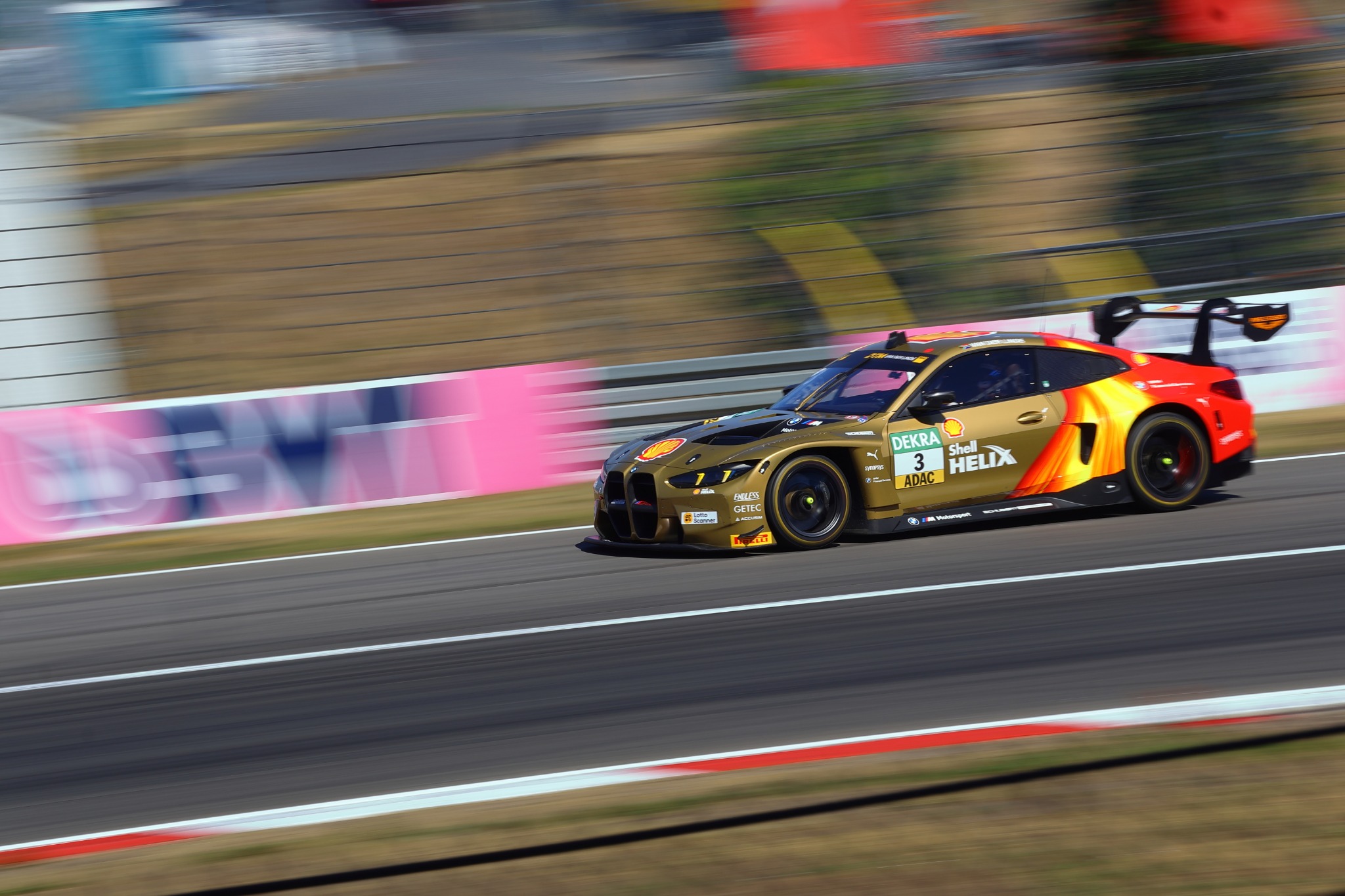Motorsport photography by Scrubii showing a BMW race car on track